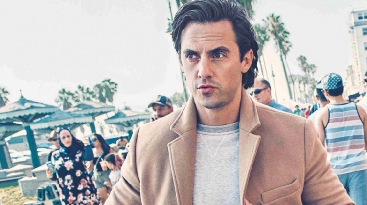 On the move, Milo Ventimiglia wears a Kelly Cole sweatshirt, Double RL joggers, and CK Jeans coat.