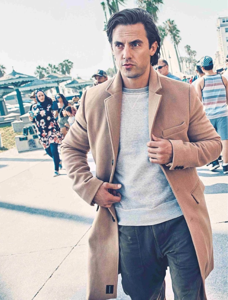 On the move, Milo Ventimiglia wears a Kelly Cole sweatshirt, Double RL joggers, and CK Jeans coat.