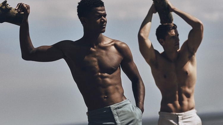 Flexing for the camera, models O'Shea Robertson and Edward Wilding rock swimwear by Orlebar Brown.