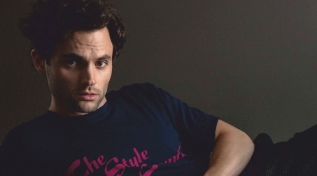 Penn Badgley Stars in Da Man Cover Shoot, Talks 'You' Posing for a studio photo, Penn Badgley wears an Opening Ceremony t-shirt, Bally trousers, and COS shoes.