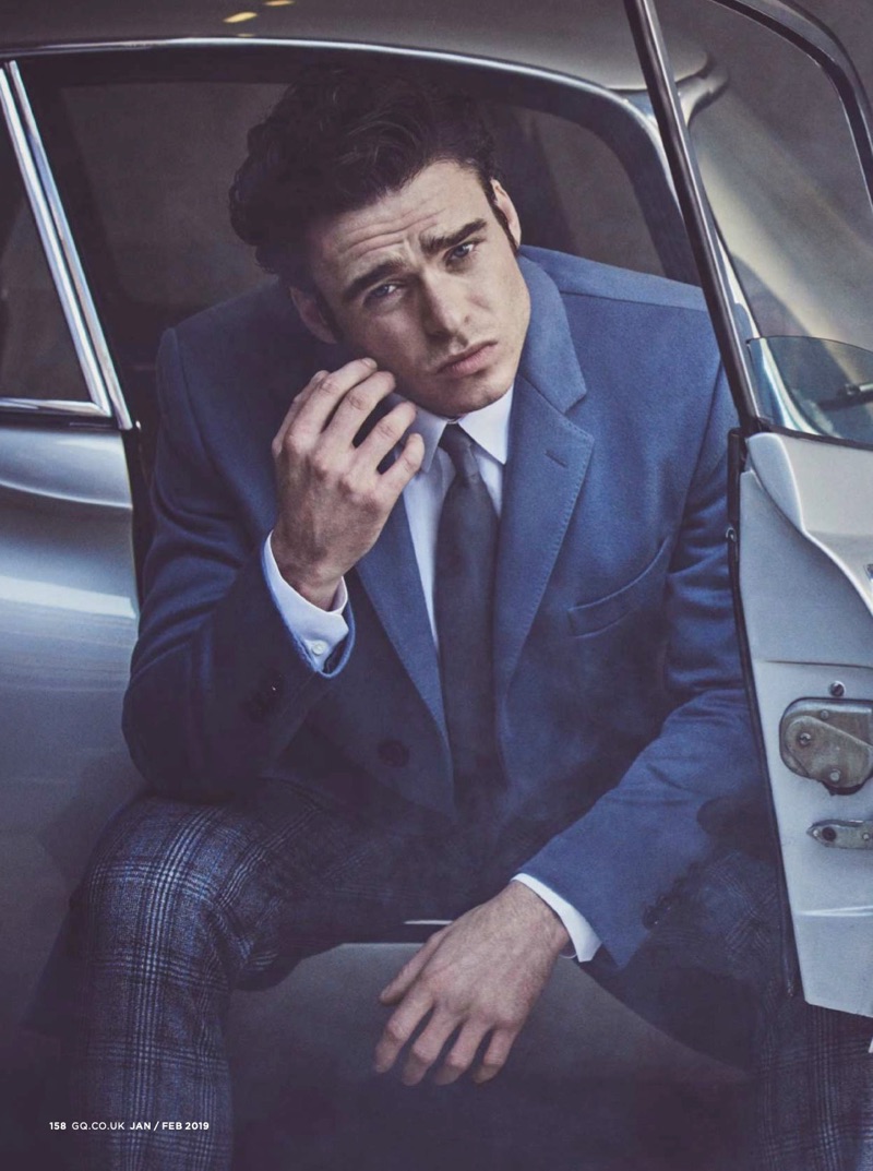 Starring in a new photo shoot, Richard Madden sports a shirt and coat by Dolce & Gabbana with pieces from Paul Smith.