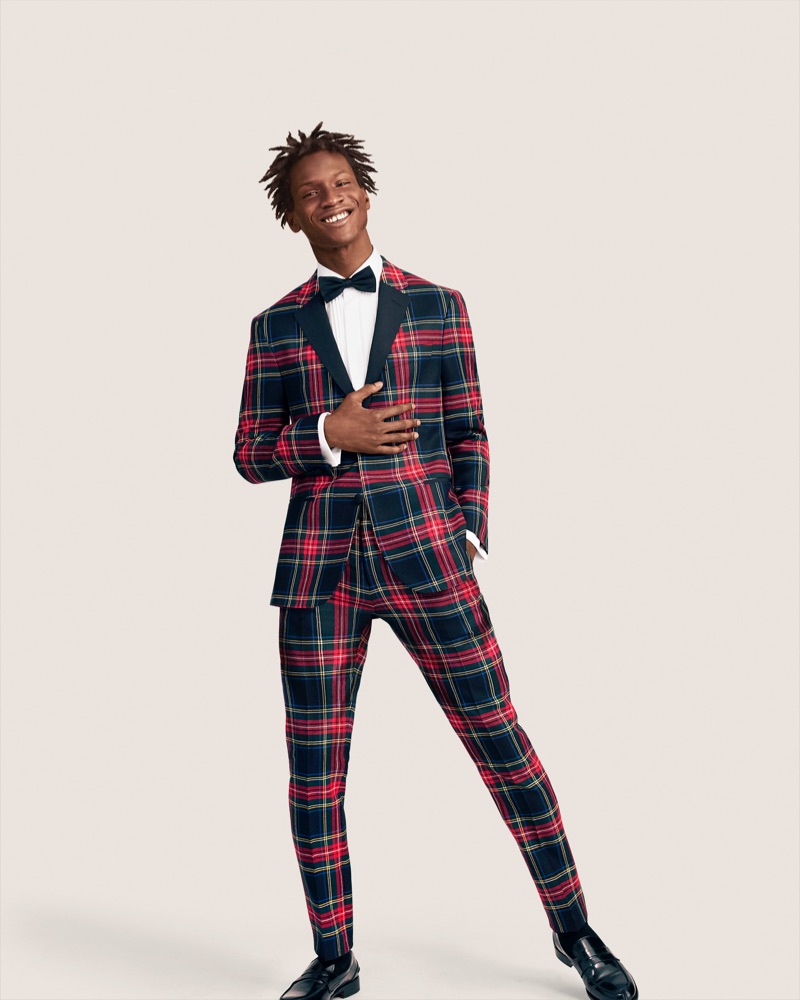 Adonis Bosso dons a wool tartan suit from Tommy Hilfiger. 