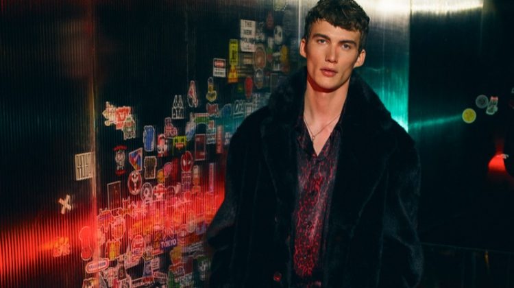 Lukas Adriaensens sports a faux fur coat with a leopard print shirt and pinstripe trousers from Zara Man.