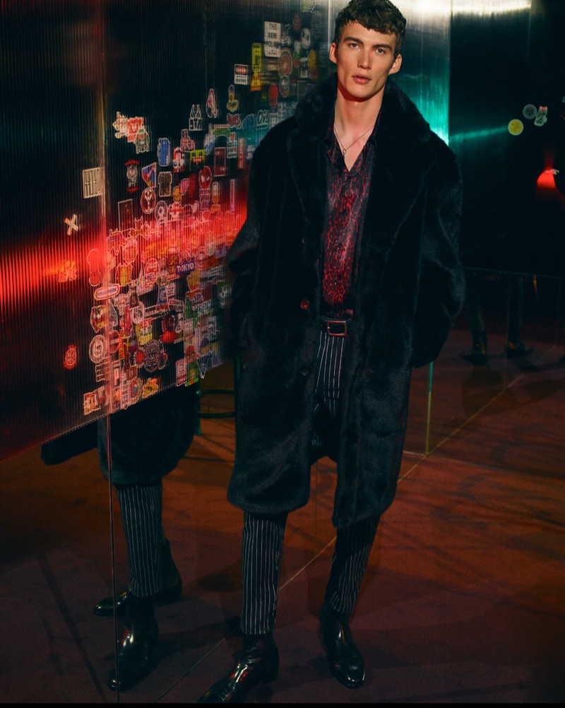 Lukas Adriaensens sports a faux fur coat with a leopard print shirt and pinstripe trousers from Zara Man.