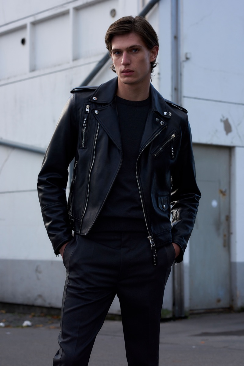 Rocking a leather biker jacket, Edoardo Sebastianelli wears Alexander McQueen.