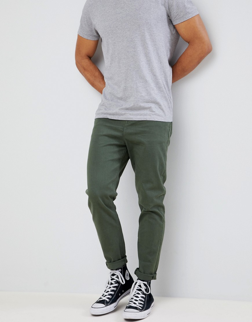 green tapered trousers