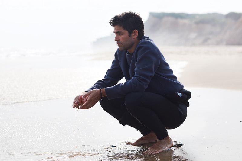 Picture-perfect, Adrian Grenier dons a life/after/denim sweatshirt with a Body Glove wetsuit.