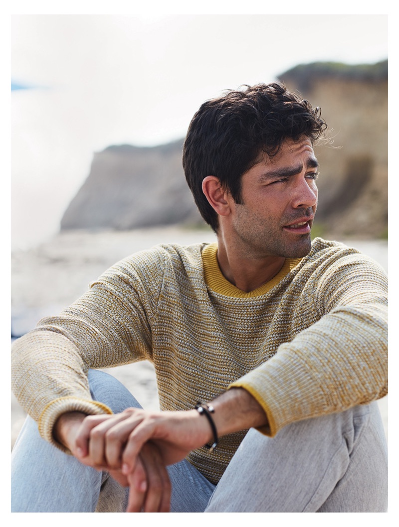 Starring in a new photo shoot, Adrian Grenier sports a Selected Homme sweater and life/after/denim trousers.