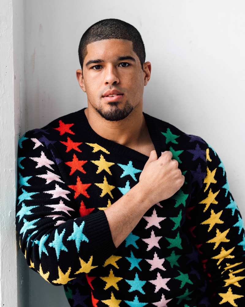 Sporting a colorful star print sweater, Anthony Bowens appears in a new photo shoot.