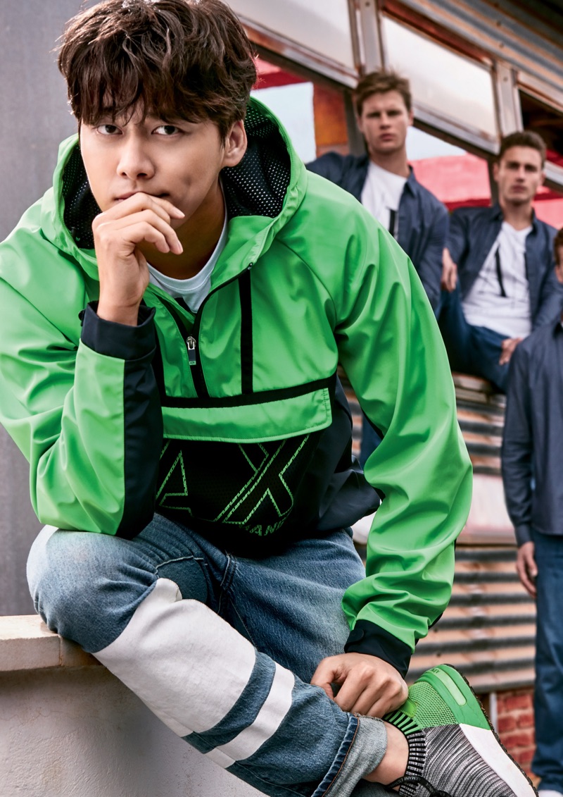 Sporting a green and black windbreaker, Li Yifeng fronts Armani Exchange's spring-summer 2019 campaign.