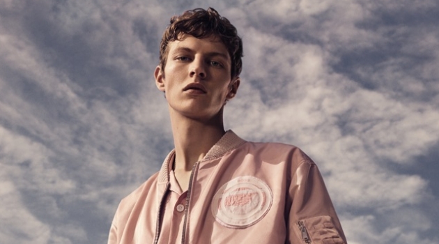 Donning a monochromatic number, Tim Schuhmacher appears in BOSS' spring-summer 2019 campaign.