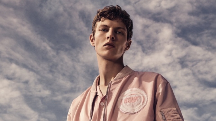 Donning a monochromatic number, Tim Schuhmacher appears in BOSS' spring-summer 2019 campaign.
