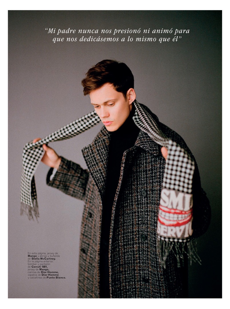 Sporting a Mango turtleneck sweater, Bill Skarsgård also wears a coat and scarf by Stella McCartney.