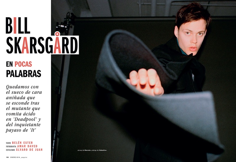 Starring in an Esquire España photo shoot, Bill Skarsgård dons a Hermès sweater with a Valentino coat.