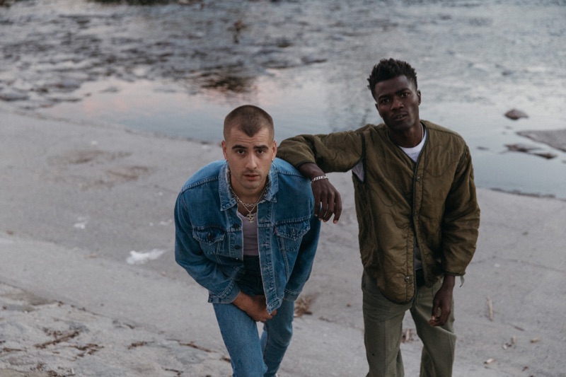 Left to Right: Blake wears late 1960s Big E trucker jacket and denim jeans Levi's. He also models a vintage 1960s ribbed tank Arrow, and custom sterling pendant Misfits, courtesy of Pastime Paradise. Remi wears vintage military scallop jacket liner and trousers with a vintage white tee courtesy of Pastime Paradise.