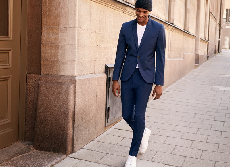 Sacha M'Baye dons a blue super skinny fit suit from H&M.