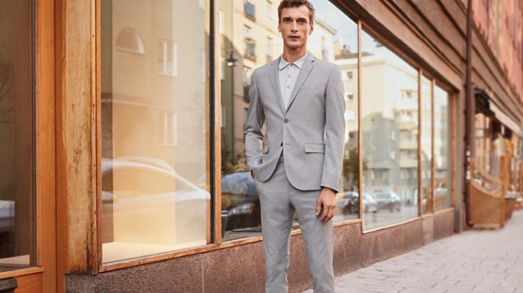 Clément Chabernaud sports a light grey skinny fit suit by H&M.