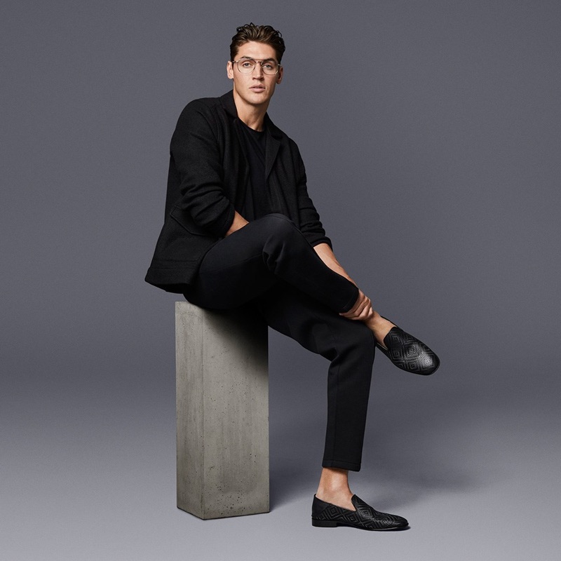 Making a refined statement, Isaac Carew wears Jimmy Choo's black embossed diamond weave leather fabric sneakers.