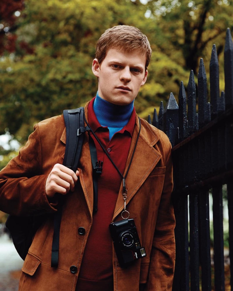 Actor Lucas Hedges dons a turtleneck, polo, and jacket by Prada.