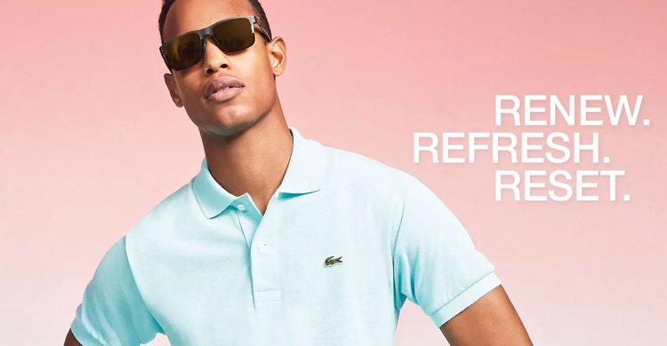 Conrad Bromfield embraces pastel spring style in a Lacoste polo shirt.