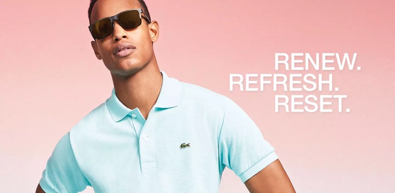 Conrad Bromfield embraces pastel spring style in a Lacoste polo shirt.
