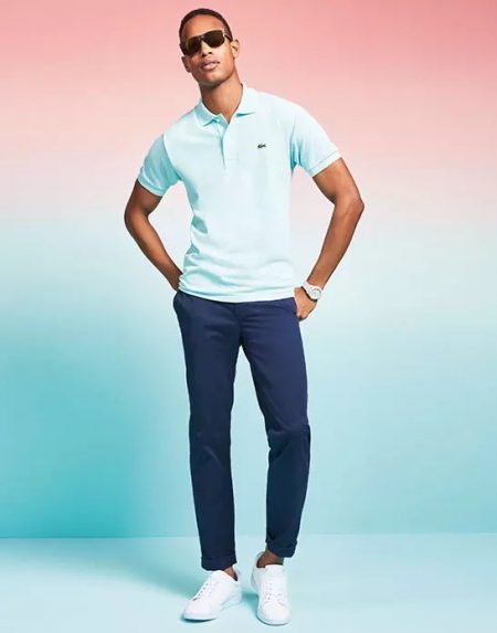 Model Conrad Bromfield wears a Lacoste polo shirt.