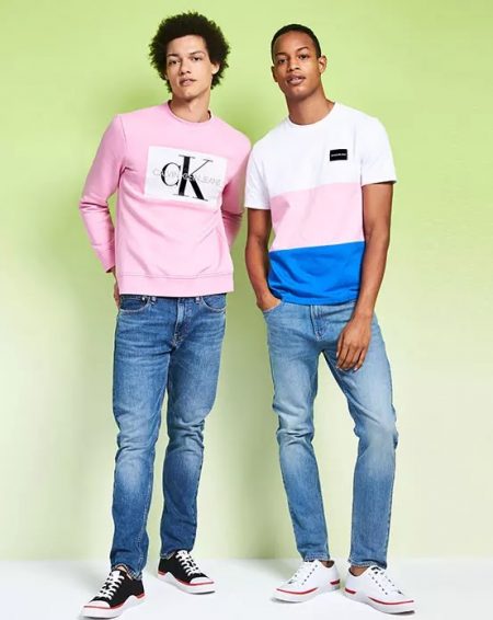 Left: Gabriel Gomieri wears a Calvin Klein Jeans sweatshirt. Right: Conrad Bromfield sports a color blocked Calvin Klein Jeans tee.
