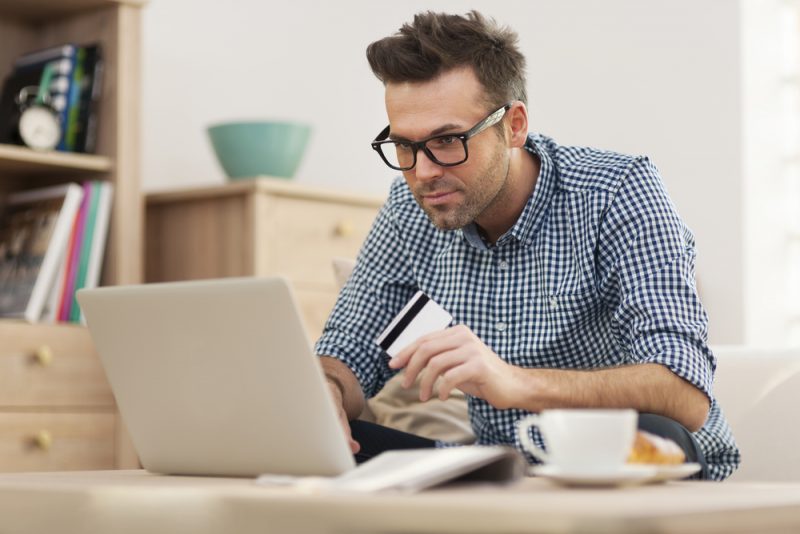 Man Shopping Online with Credit Card