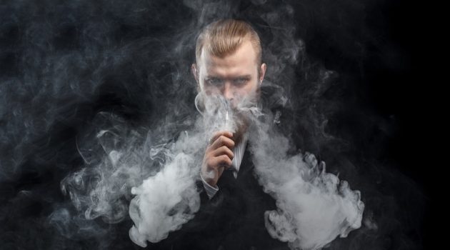 Most Iconic Accessory Items of 2018 Man Vaping Smoke