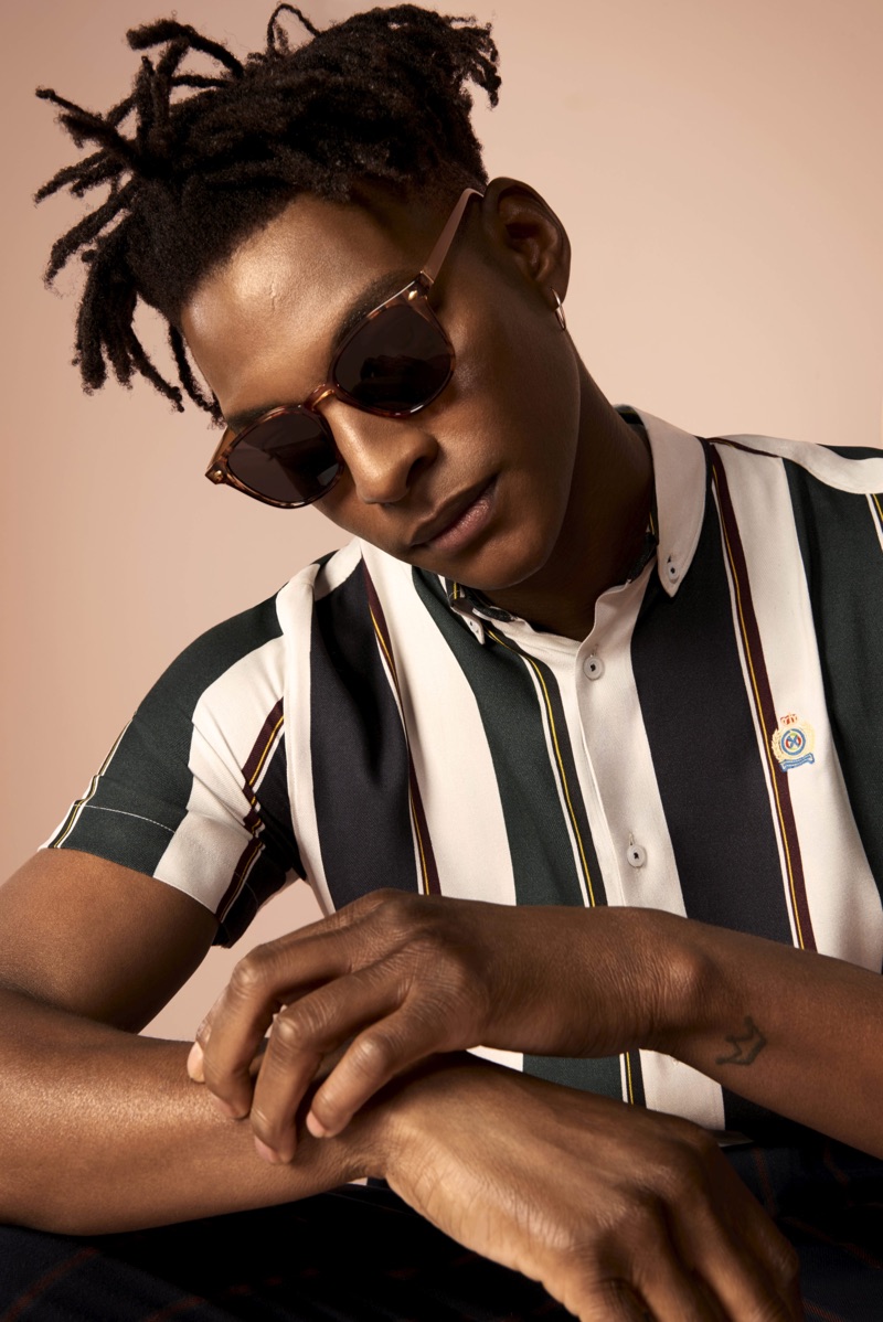 Rocking sunglasses, Ty Ogunkoya fronts River Island's spring 2019 campaign.