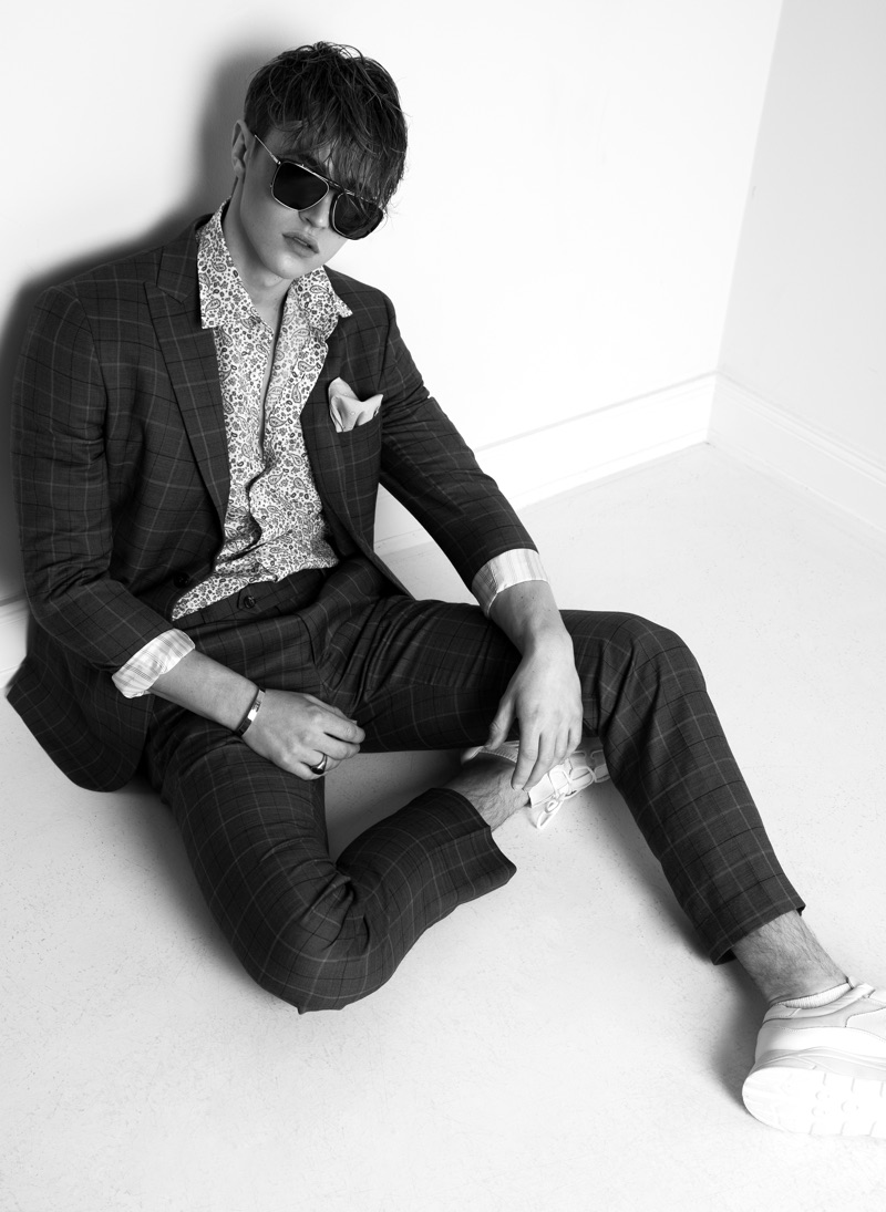 Sebastian wears suit Reserved, sunglasses Jerome Boateng, shirt, and handkerchief Eterna.