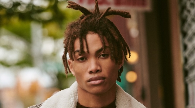 Seth Hill Inspires in Outerwear from East Dane Reuniting with East Dane, Seth Hill sports a Kenzo jacket, De Bonne mock neck sweater, and Lemaire pleated trousers.