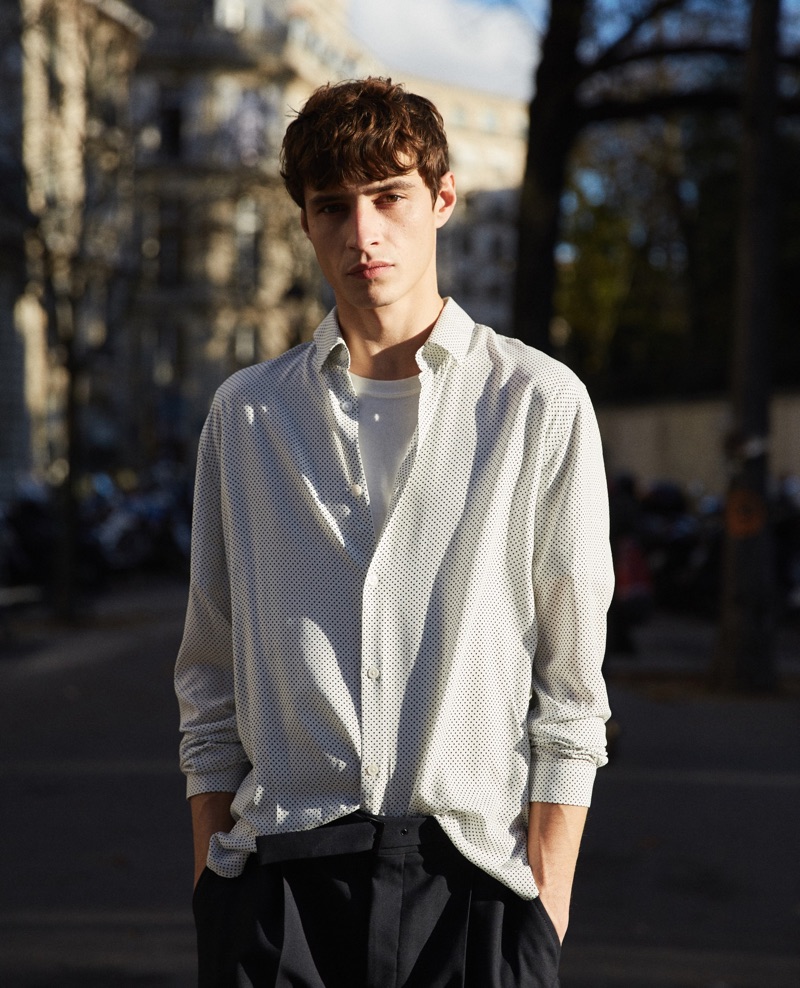 Adrien Sahores dons a micro polka dot print shirt from The Kooples.