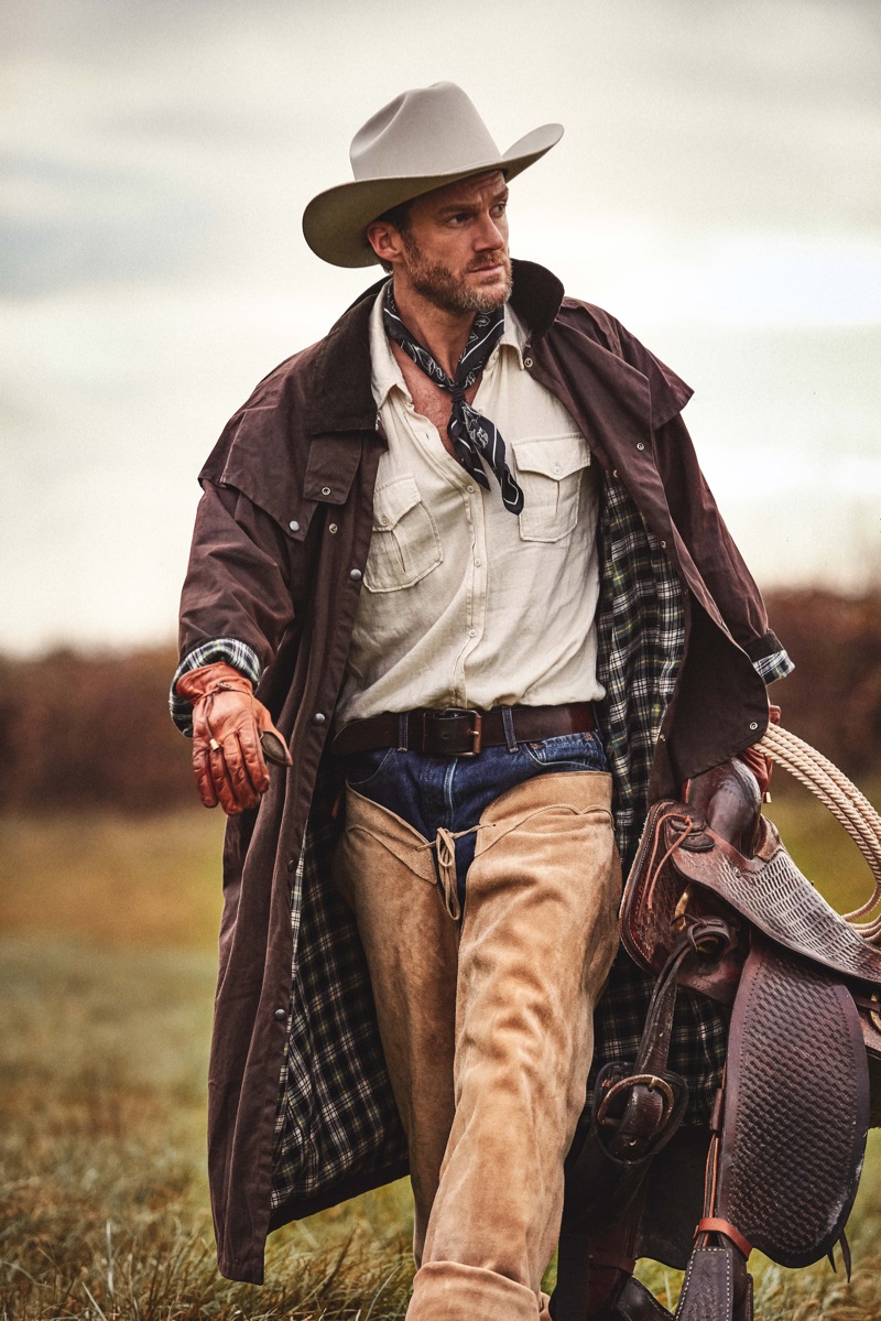 Yohan wears hat and gloves Stetson, shirt and jeans Levi's, coat Barbour, vintage scarf, and chaps Harpo Paris.