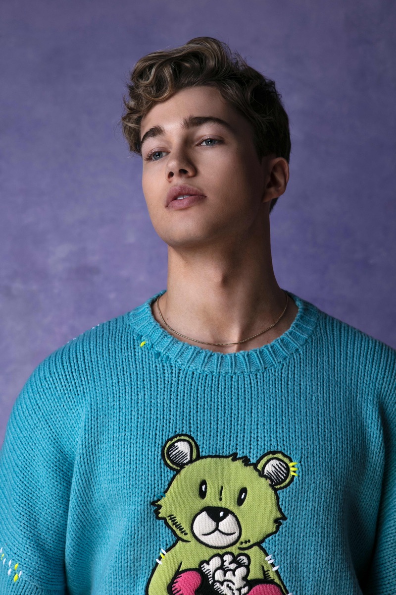 Dancer AJ Pritchard sports an AMIRI bear sweater.