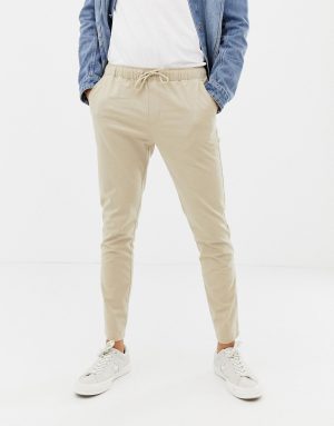 ASOS DESIGN skinny chinos in putty with elastic waist - Beige ASOS DESIGN skinny chinos in putty with elastic waist - Beige