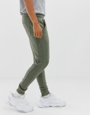 ASOS DESIGN skinny sweatpants with ribbed side stripe and acid wash - Green ASOS DESIGN skinny sweatpants with ribbed side stripe and acid wash - Green