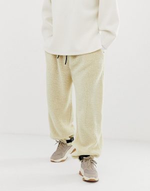 ASOS DESIGN tapered jogger in borg with clip hem in beige - Beige ASOS DESIGN tapered jogger in borg with clip hem in beige - Beige