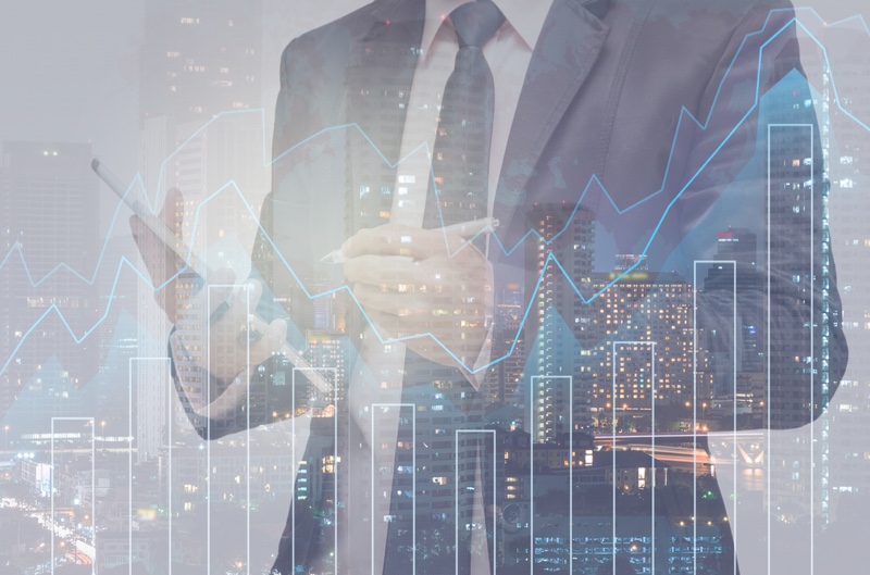 Business Man in Suit with Trading Graph