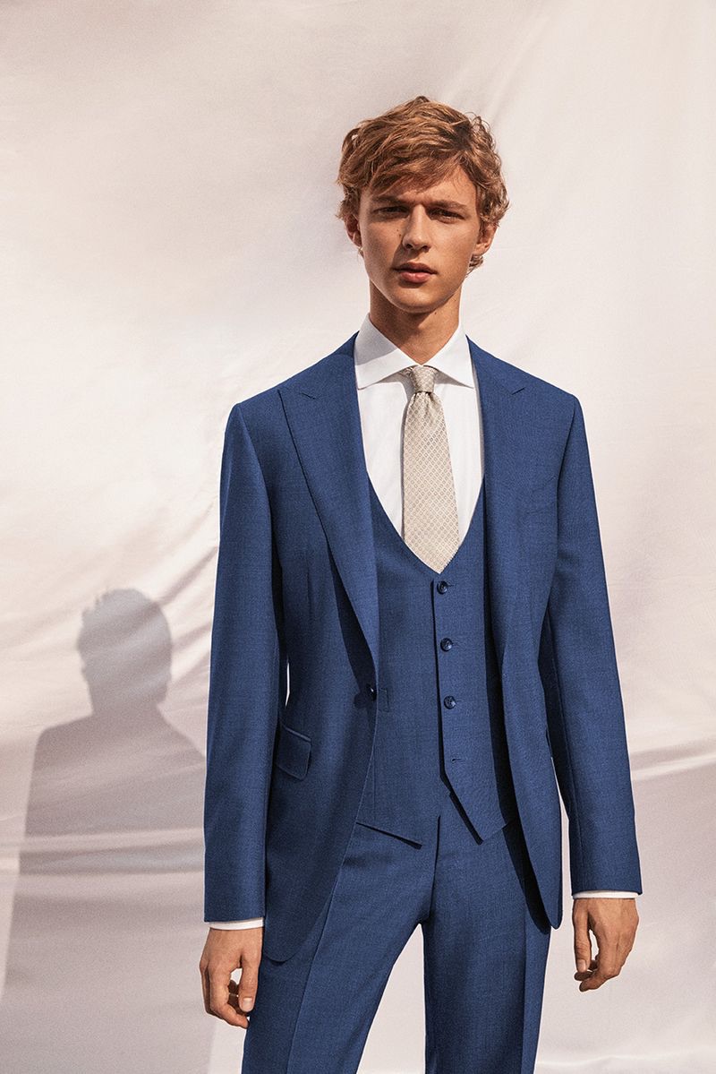 Max Barczak dons a blue three-piece suit from Canali's spring-summer 2019 wedding collection.