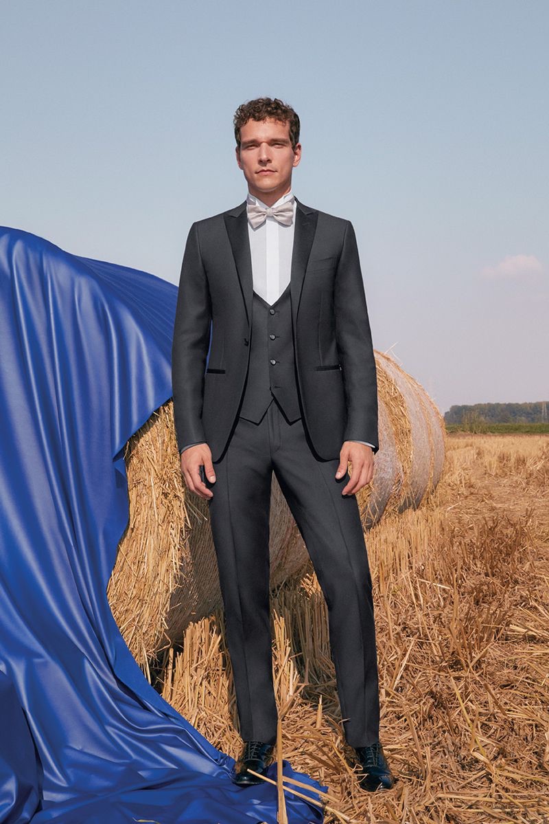 Dressed to the nines, Alexandre Cunha sports a three-piece Canali suit.