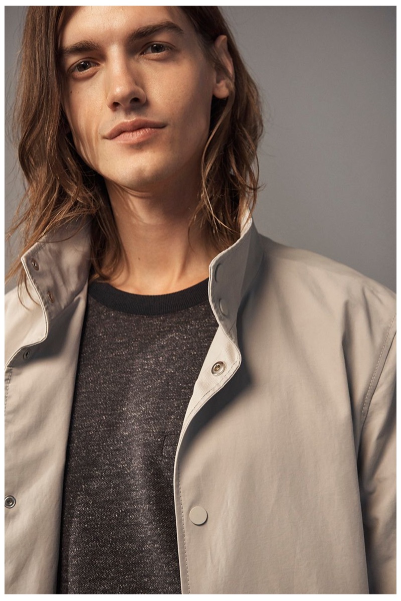 Ready for his close-up, Christian Plauche dons a Club Monaco lightweight mac jacket and twill pullover.