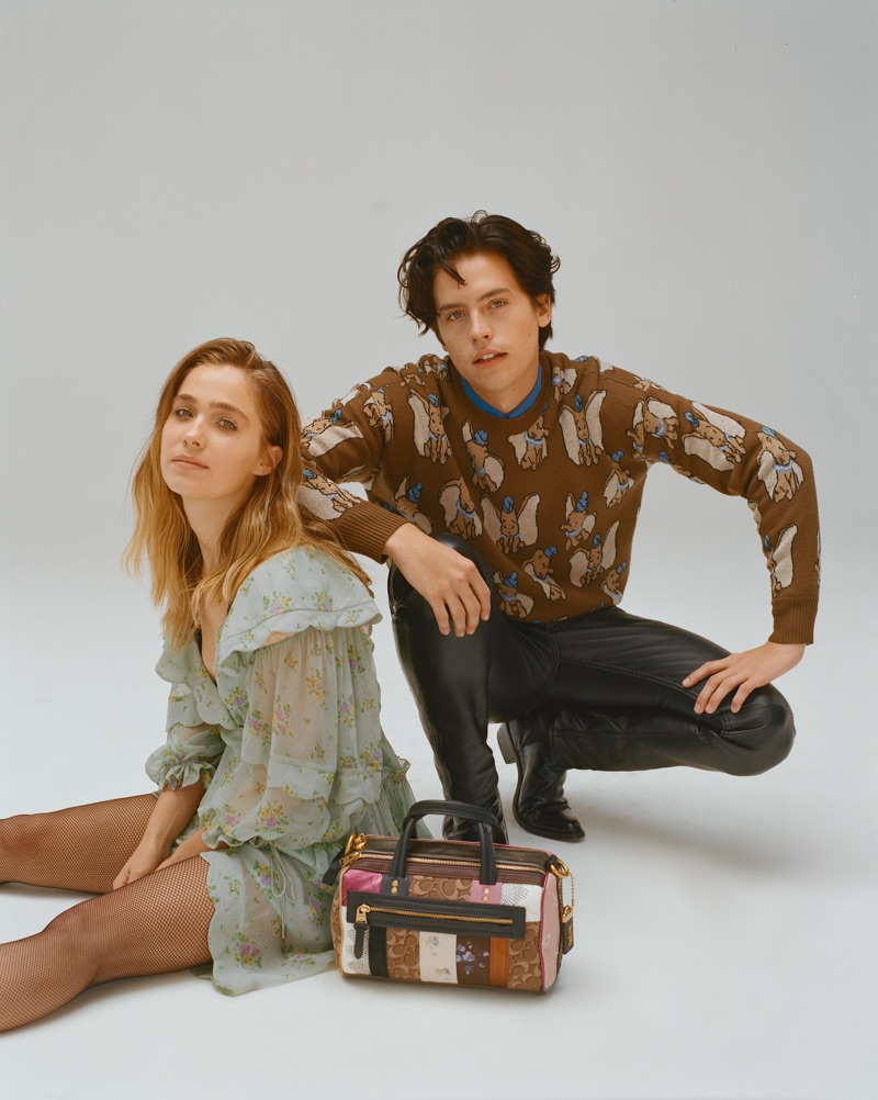 Sporting a Coach Dumbo sweater, Cole Sprouse appears in a photo shoot with Haley Lu Richardson.