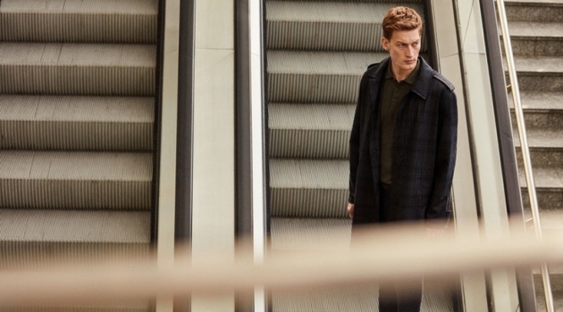 Bastian Thiery & Craig Roberts Are Surveilled for Corneliani Spring '19 Campaign Riding the escalator, Bastian Thiery models a spring-summer 2019 look from Corneliani.
