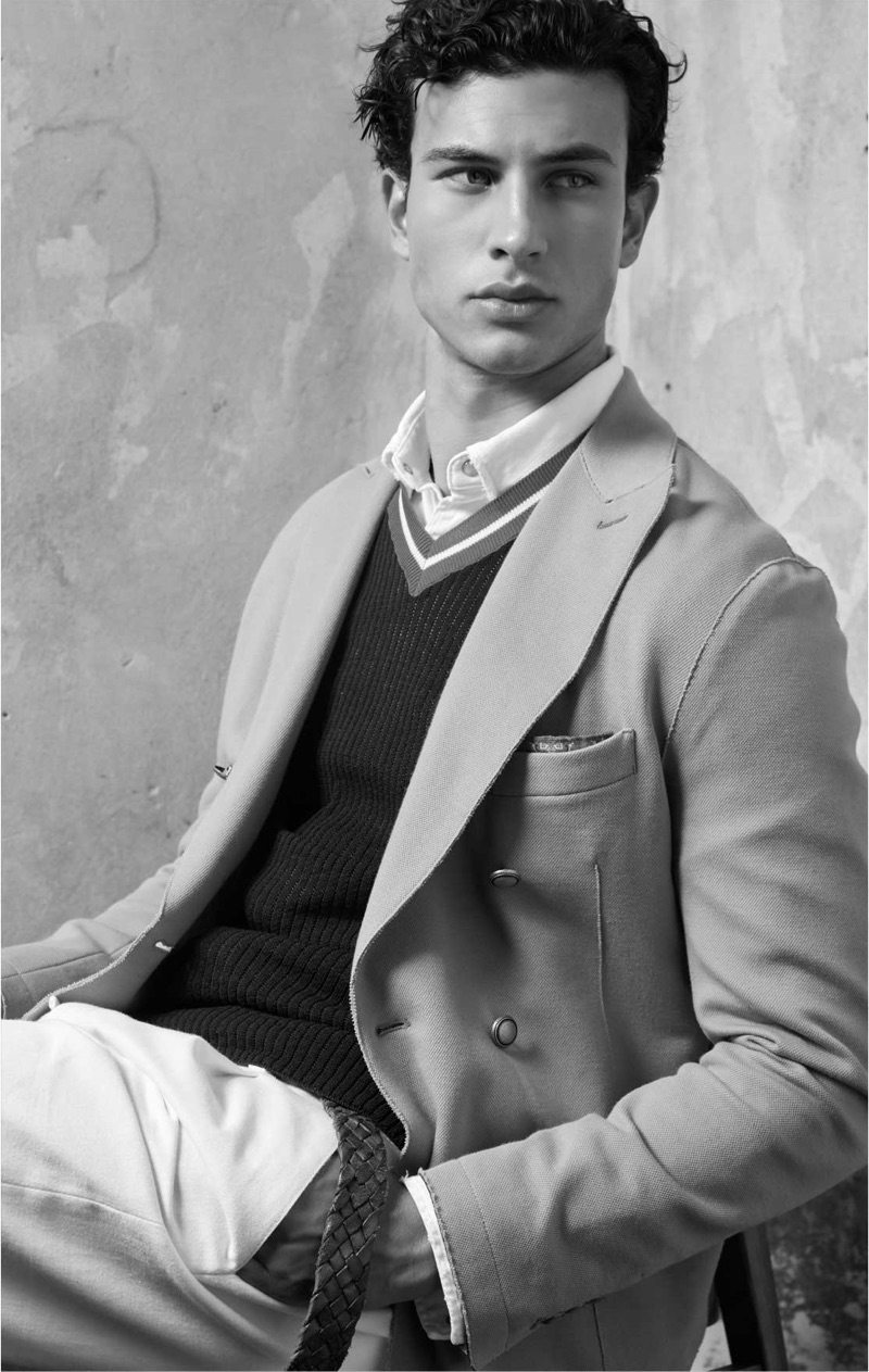 Sporting a v-neck sweater and blazer,  Mattia Narducci wears Eleventy.