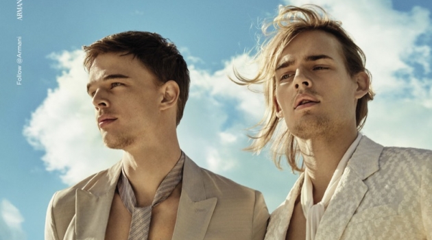 Donning neutral suits, André Bona and Ton Heukels front Emporio Armani's spring-summer 2019 campaign.