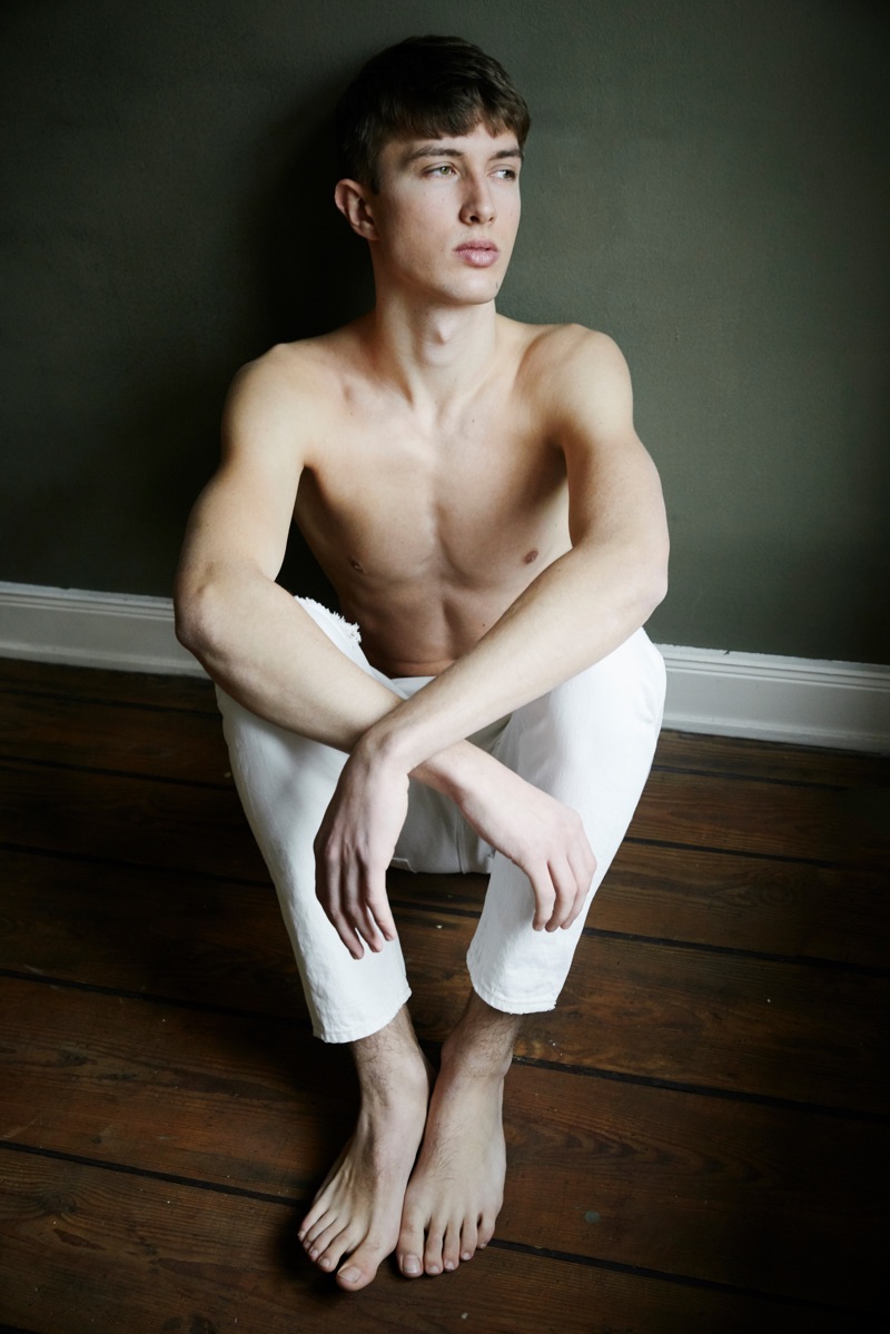 Rocking white Closed jeans, Felix Sauerbrey sits for a portrait.