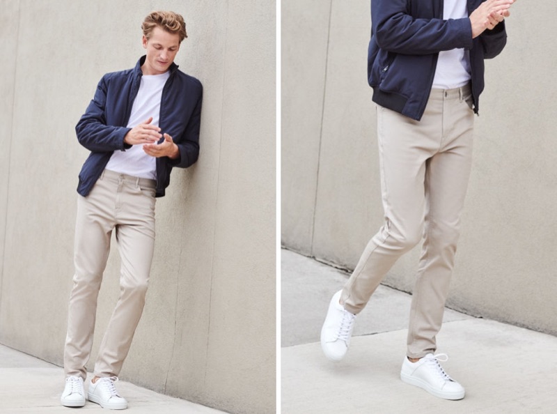 Embracing relaxed everyday style, Hugo Sauzay dons H&M's 5-pocket slim chino pants with a lightweight jacket, white sneakers, and t-shirt.