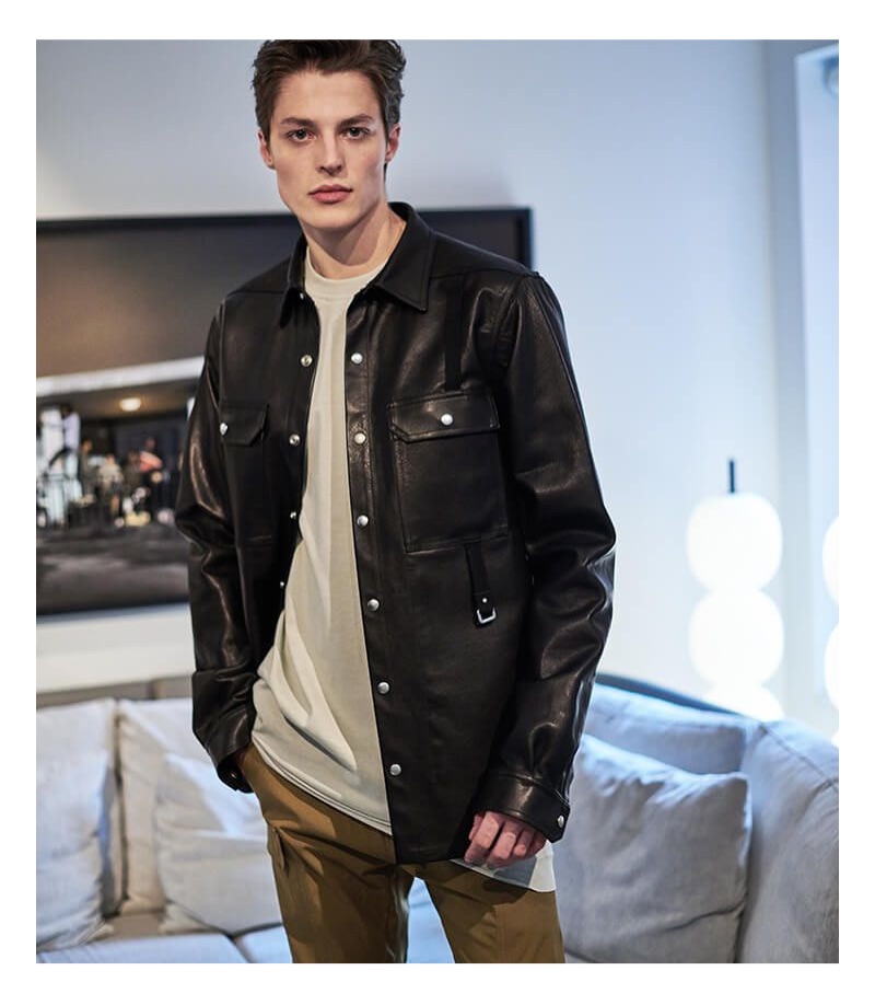 Making a statement, Brodie Scott wears a Rick Owens leather shirt jacket, long-sleeve t-shirt, and cargo jogger pants.