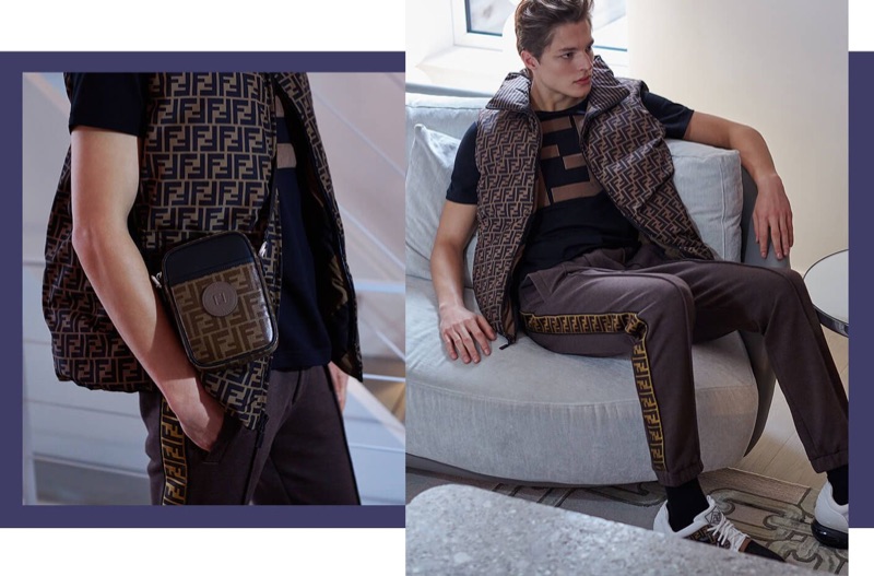 Embracing a Fendi look, Brodie Scott rocks a nylon vest, t-shirt, jogger pants, messenger bag, and sneakers.